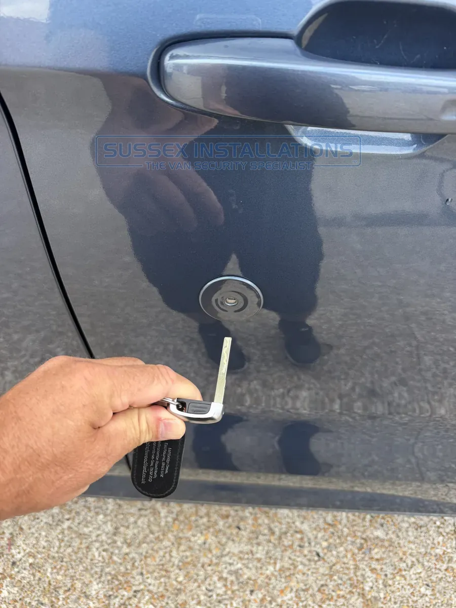 Walking to the Ford Custom holding only the manual key blade, without the remote control