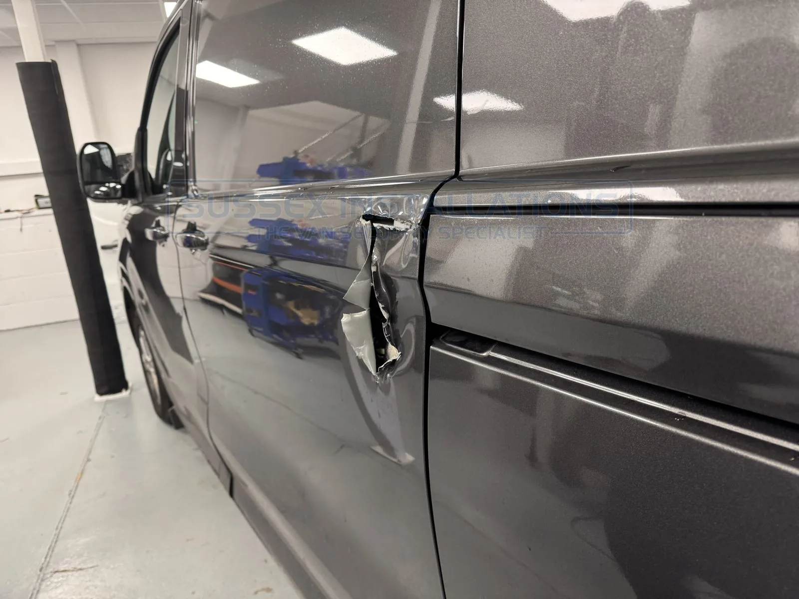 A new-shape Ford Custom with huge XL damage, delivered from the Midlands for shield development