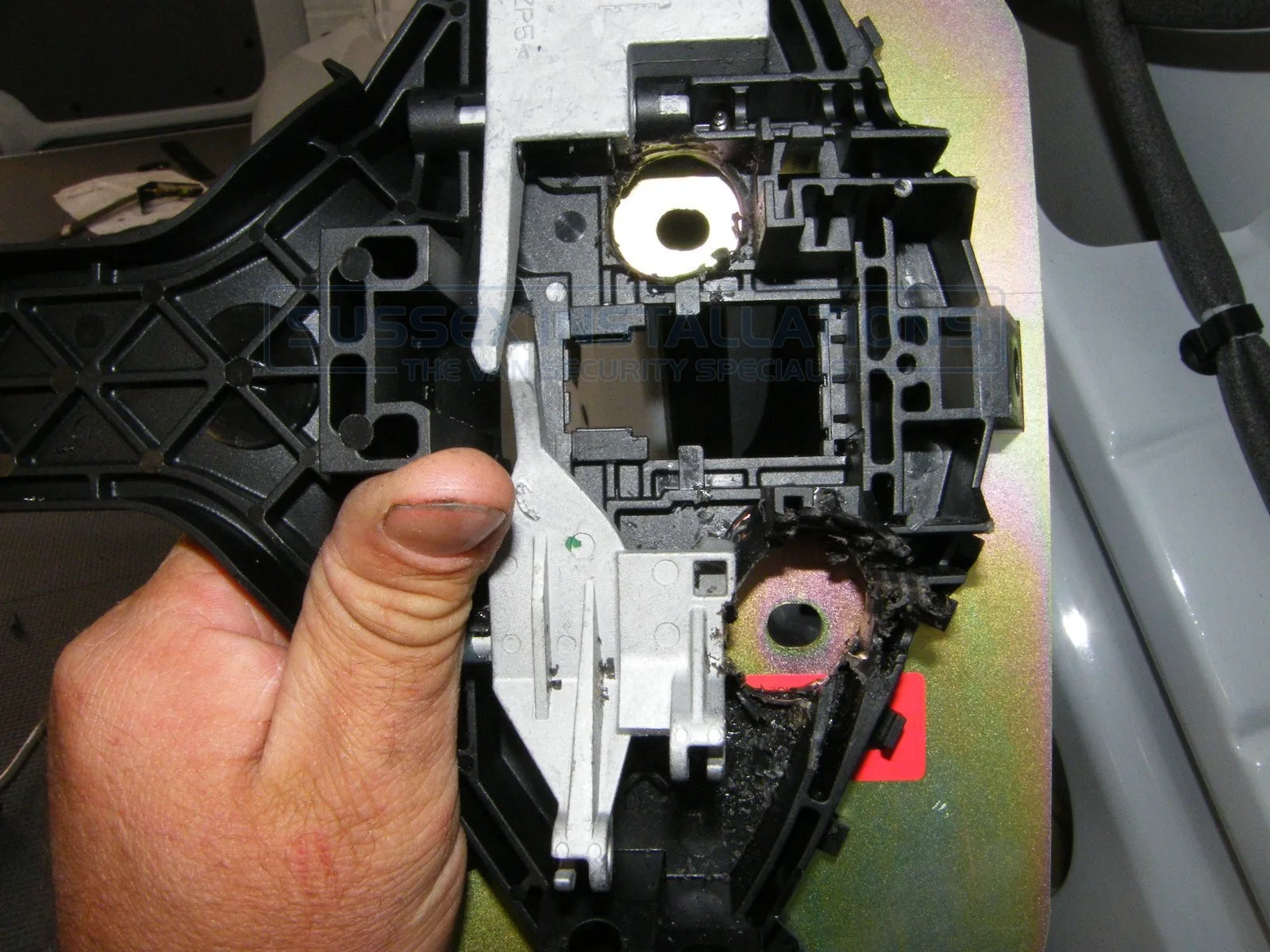 An Armaplate handle mechanism partially dismantled and modified so that it would fit