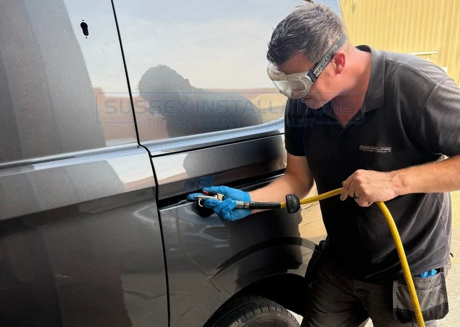 Professional clean-down after deadlock fitting to remove metal filings from a van door