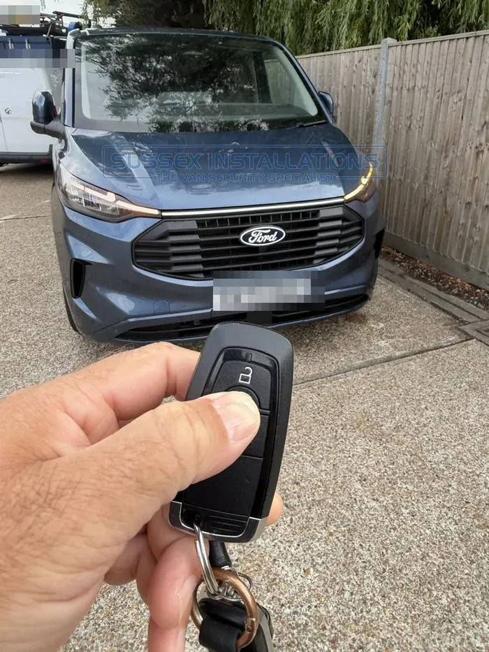 Pressing the lock button on a Ford Custom remote control twice to lock the van