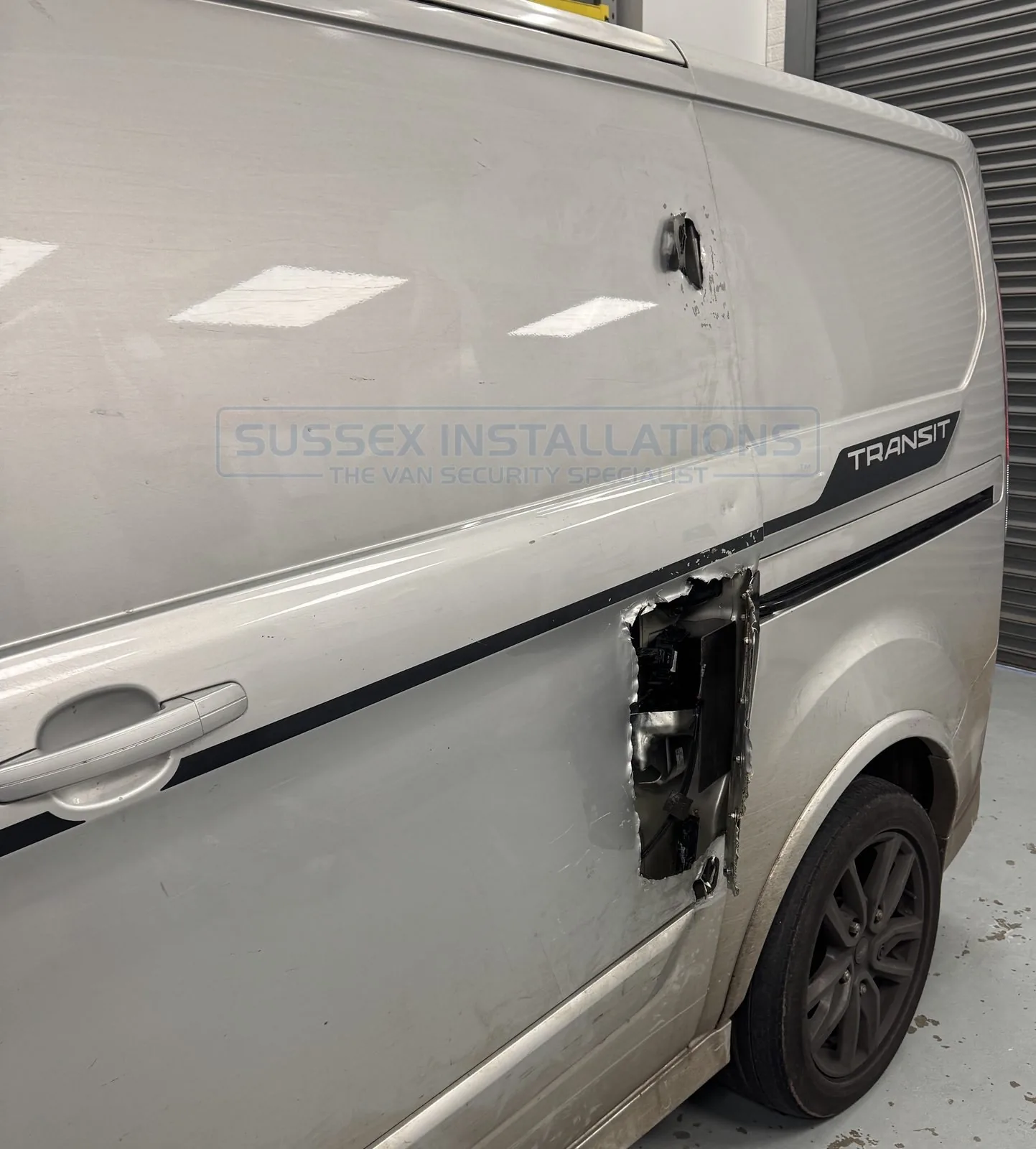 A shield to repair XL damage on a Ford Custom side door
