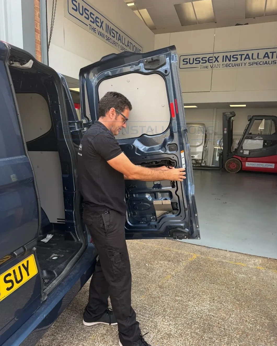 Jeff Scott examining the internal construction of a commercial vehicle door