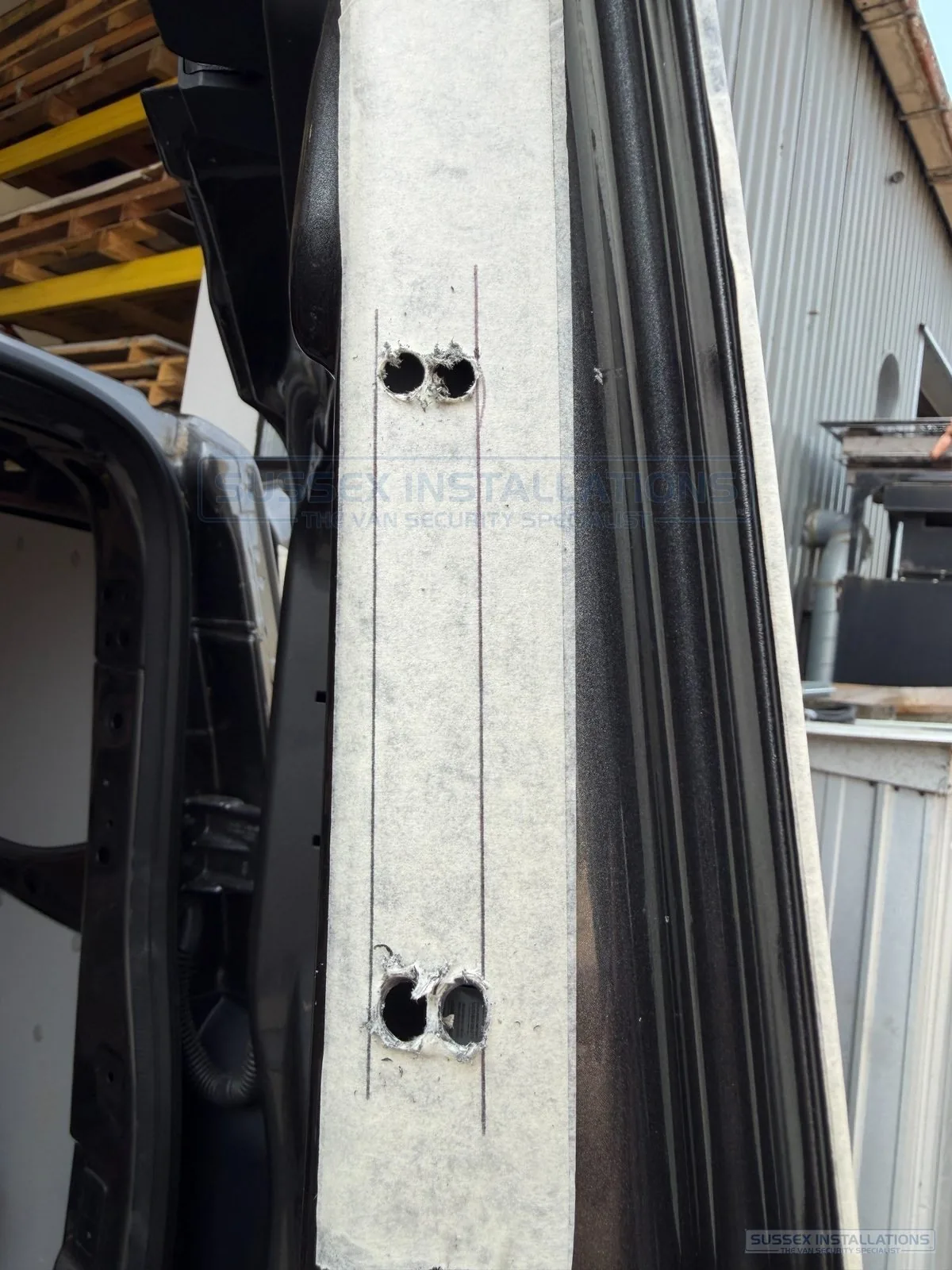 Pilot holes prepared for cutting a deadlock lockcase aperture