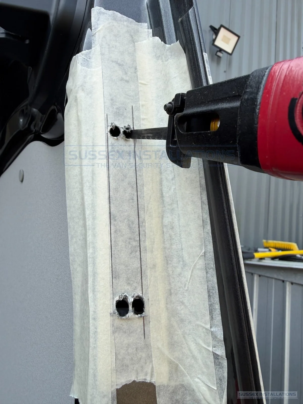 Air saw blade joining pilot holes for a van deadlock lockcase aperture