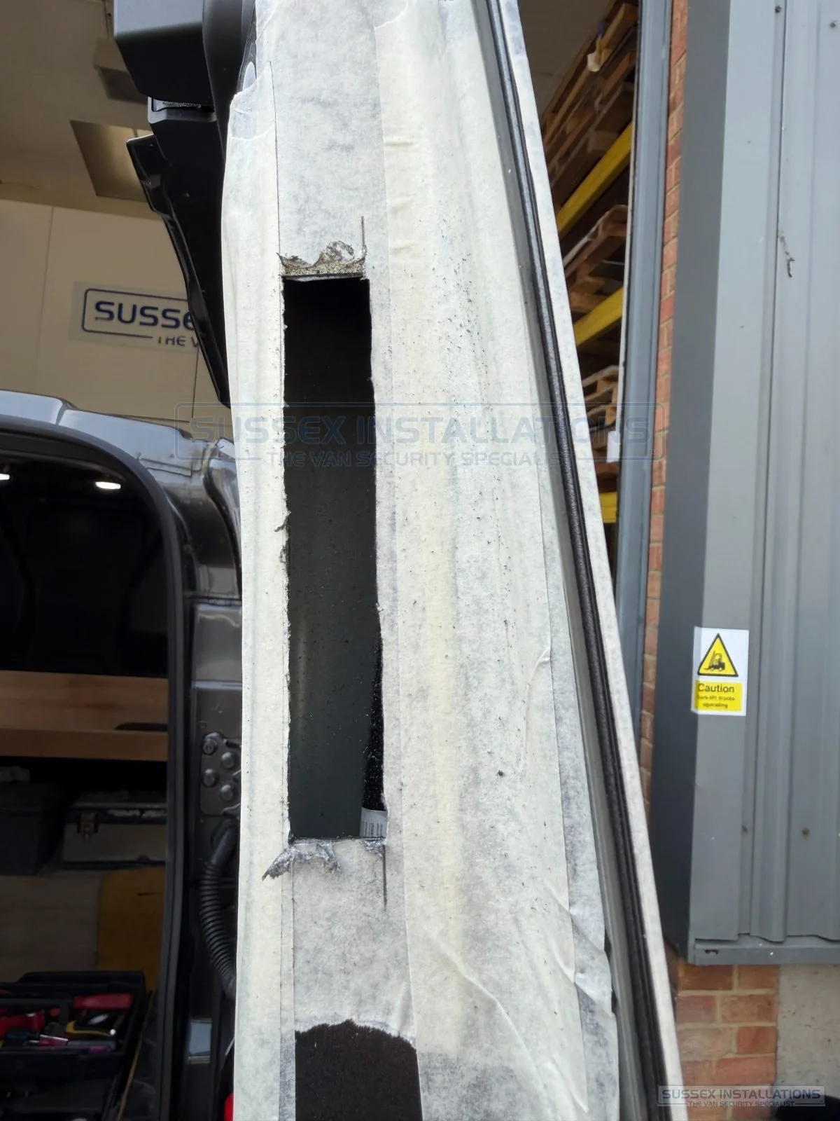 Finished rectangular lockcase aperture cut into a van door edge