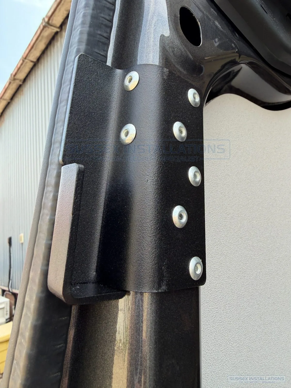 Internal reinforcement bracket fitted behind a van deadlock keep