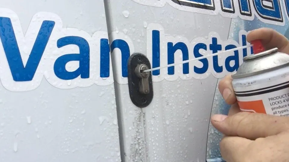 Lock maintenance and cleaning being demonstrated on a van security lock