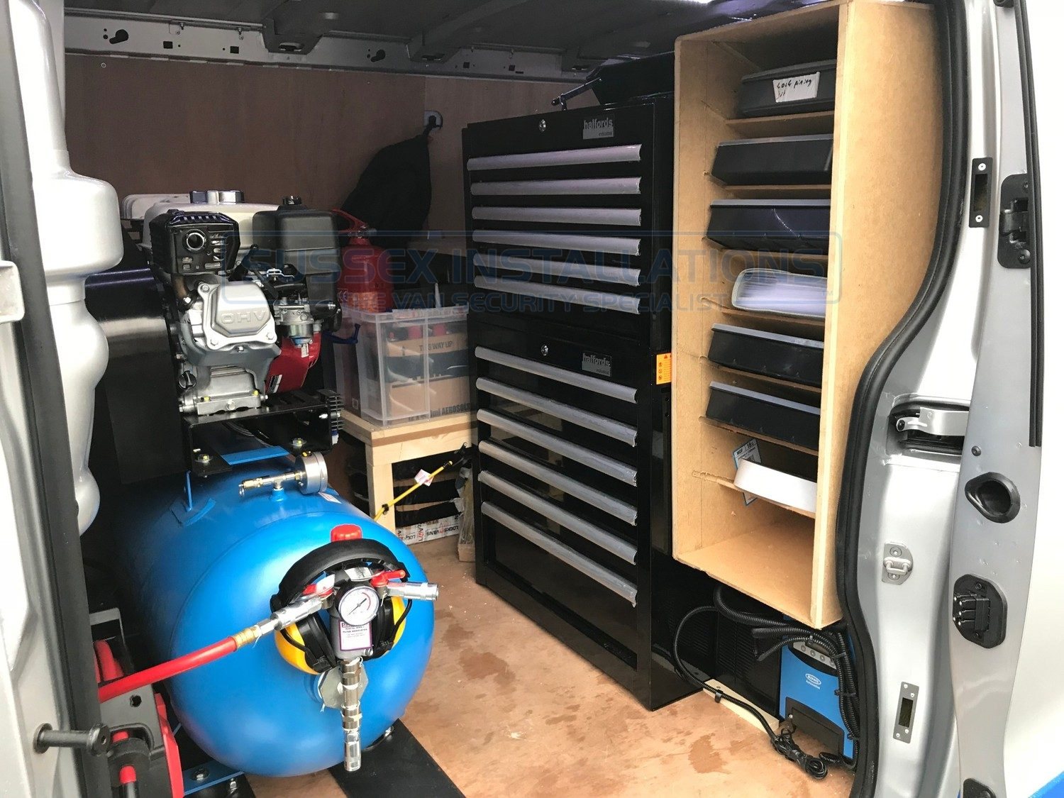 Sussex Installations mobile workshop van fitted with a full-size petrol compressor, air receiver, tools and parts storage