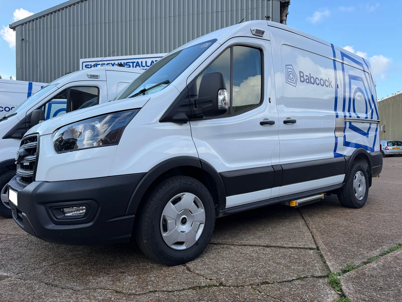 Ford Transit service van in front of the Sussex Installations workshop after security fitting