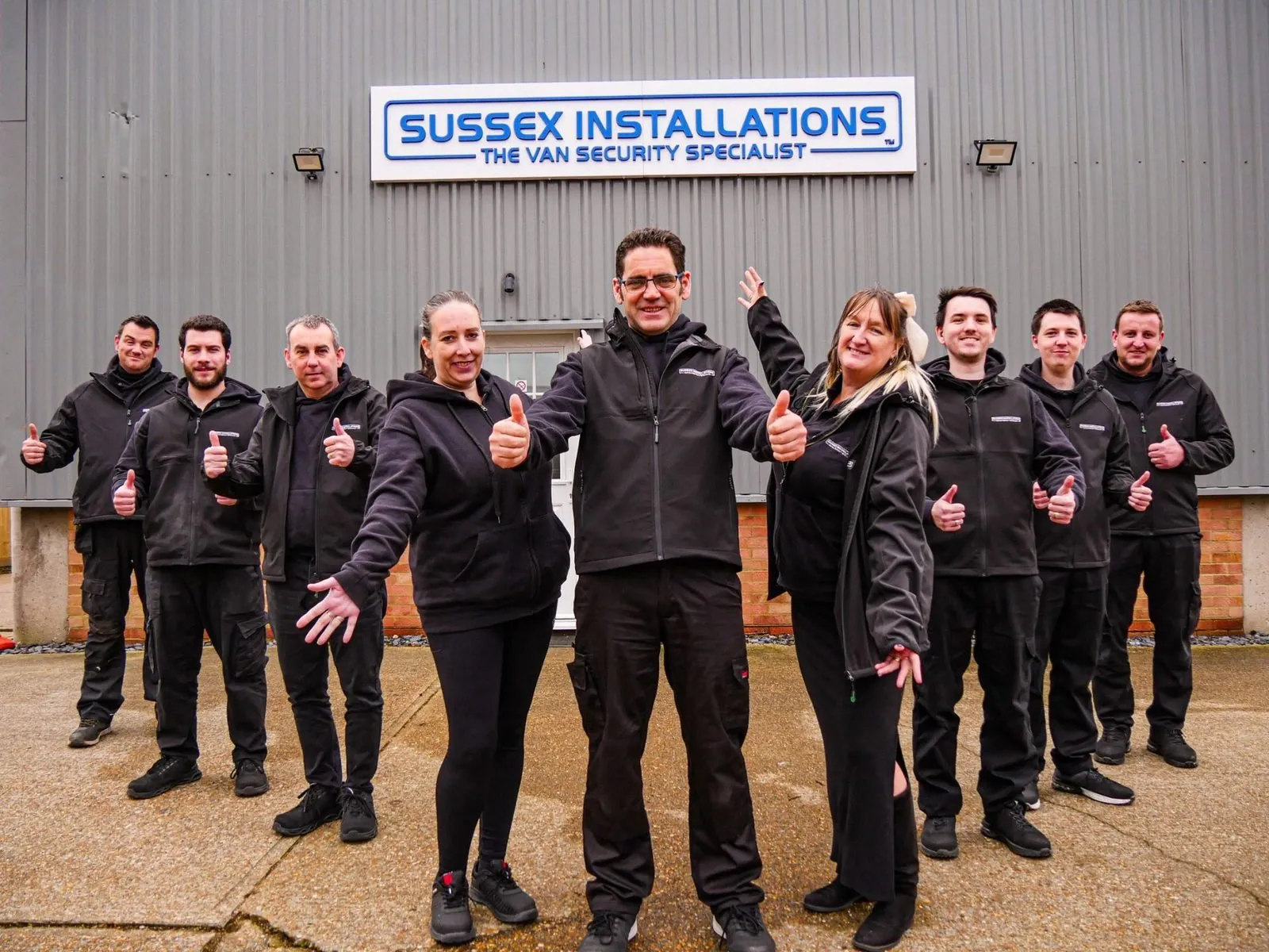 The Sussex Installations team outside their premises