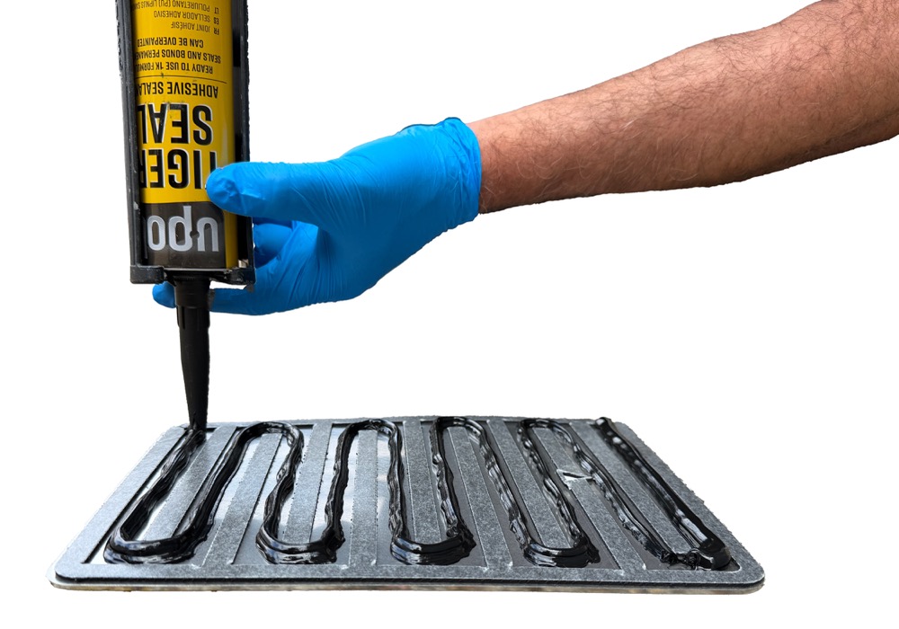 Apply adhesive to gasket channels